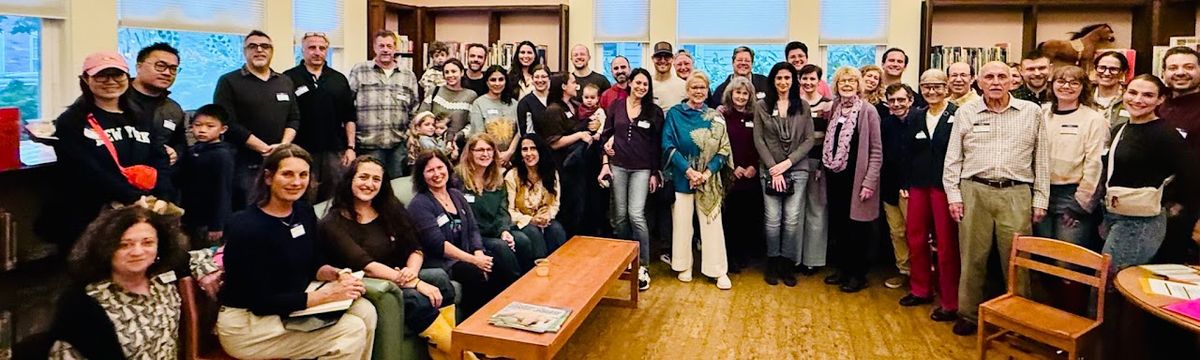 A large group of neighbors at an indoor Sea Cliff Civic Association gathering